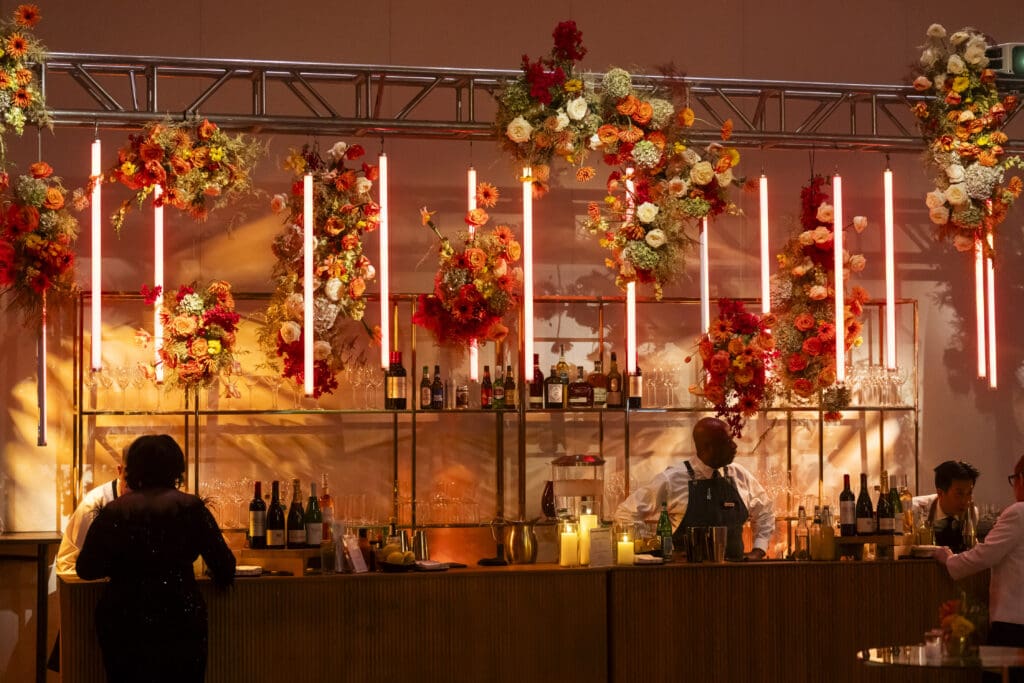 A spectacular floral and light install for a corporate event's bar.